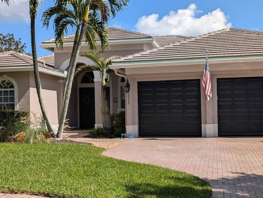 Flat concrete tile roof installation by Expert Roofing Services — Eagle roofing tile with new vents on a South Florida home